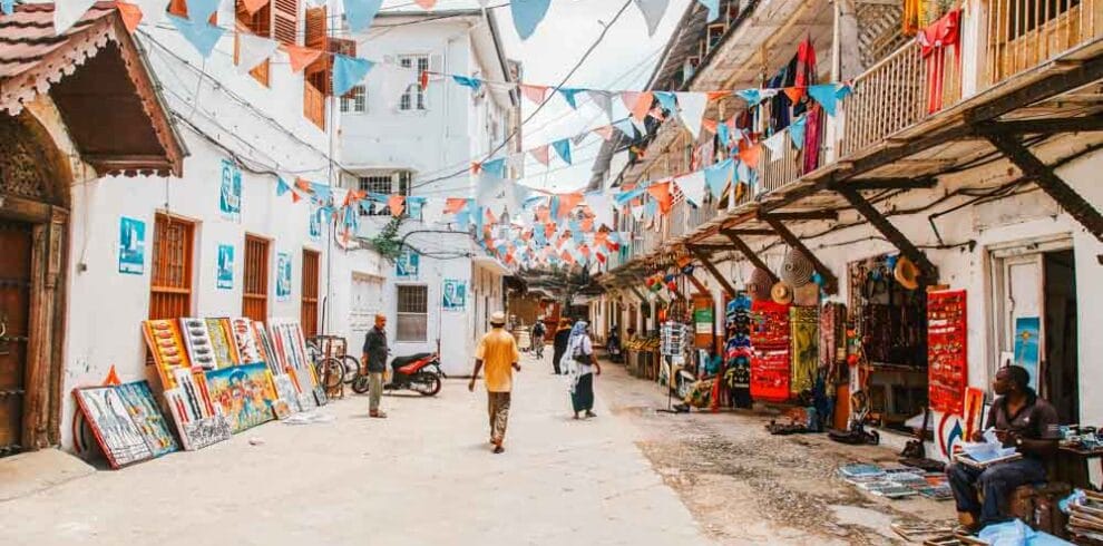 Local people on a street in stone town. stone town is the old part of zanzibar city, the capital of zanzibar, tanzania